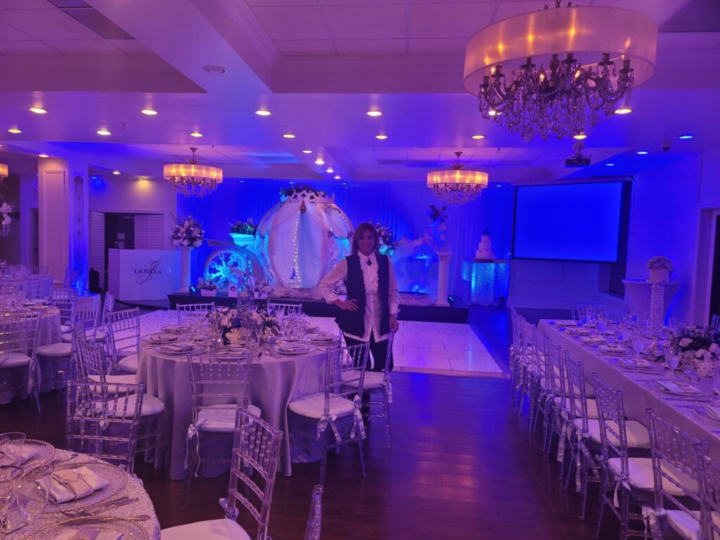 Event production manager standing in an elegantly decorated venue in Boca Raton, FL